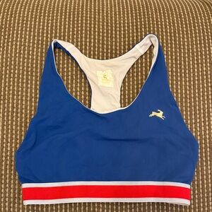 Tracksmith Blue Sports Bra with Red and White Accents
